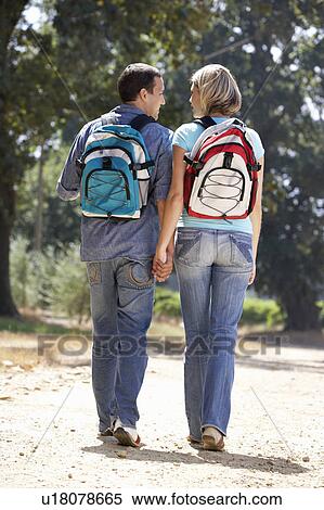 Couple on country walk View Large Photo Image Stock Photography - Couple on country walk. Fotosearch