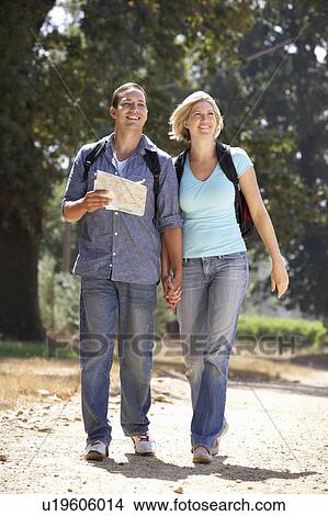 Couple with map on country walk View Large Photo Image Picture - Couple with map on country walk. Fotosearch