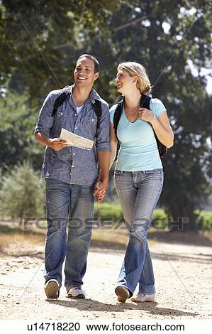 Couple with map on country walk View Large Photo Image Stock Image - Couple with map on country walk. Fotosearch