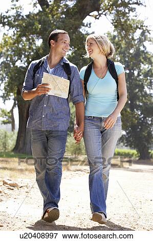 Couple with map on country walk View Large Photo Image Stock Photo - Couple with map on country walk. Fotosearch