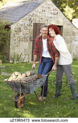 Couple working in country garden View Large Photo Image Stock Image - Couple working in country garden. Fotosearch