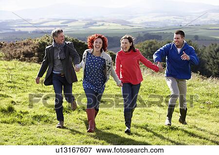 Stock Photo - Couples on country walk. Fotosearch