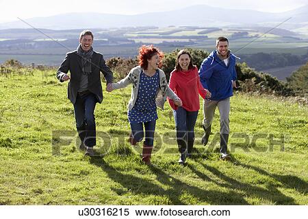 Stock Photography - Couples on country walk. Fotosearch