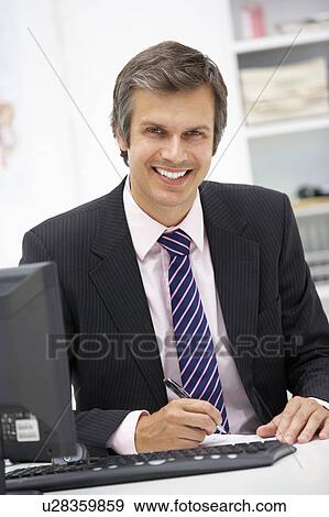 Stock Photo - Doctor at desk. Fotosearch