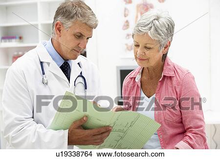 Picture - Doctor with female patient. Fotosearch