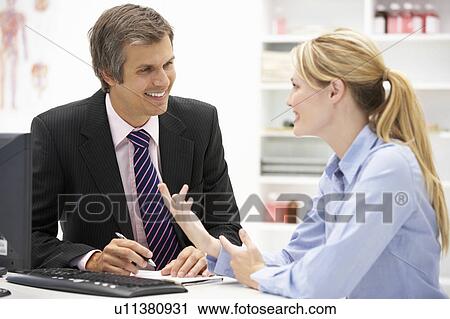 Doctor with female patient View Large Photo Image Stock Image - Doctor with female patient. Fotosearch
