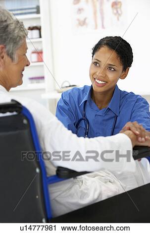 Doctor with female patient View Large Photo Image Stock Image - Doctor with female patient. Fotosearch