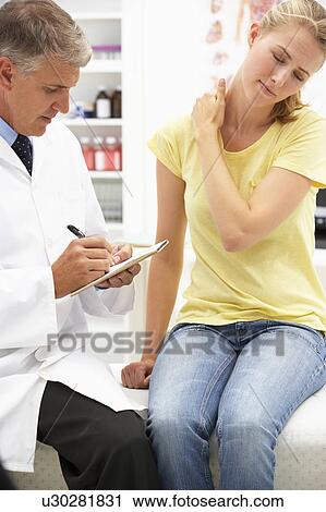 Doctor with female patient View Large Photo Image Stock Image - Doctor with female patient. Fotosearch