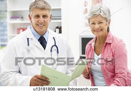 Stock Photo - Doctor with female patient. Fotosearch