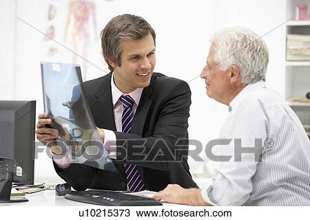 Doctor with senior patient View Large Photo Image Stock Image - Doctor with senior patient. Fotosearch