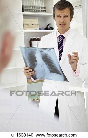 Doctor with senior patient View Large Photo Image Stock Image - Doctor with senior patient. Fotosearch
