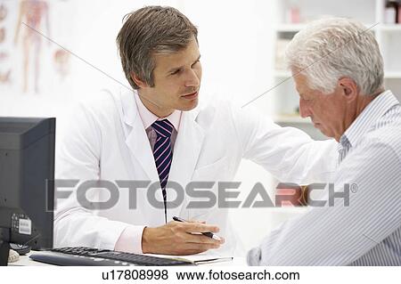 Stock Photo - Doctor with senior patient. Fotosearch
