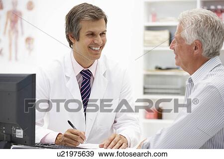 Doctor with senior patient View Large Photo Image Stock Photo - Doctor with senior patient. Fotosearch