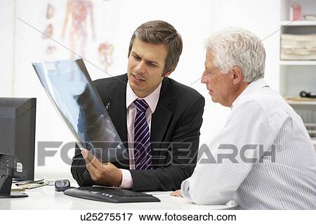 Doctor with senior patient View Large Photo Image Stock Photo - Doctor with senior patient. Fotosearch