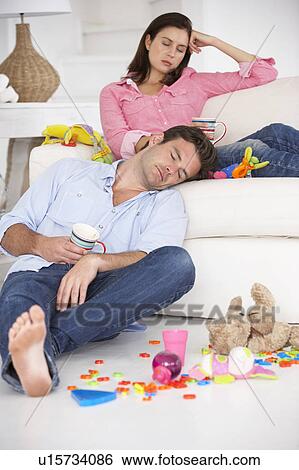 Exhausted parents resting View Large Photo Image Stock Photograph - Exhausted parents resting. Fotosearch