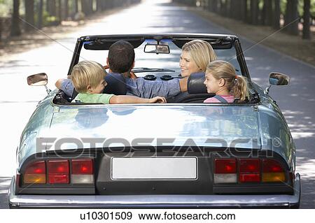 family in sports car View Large Photo Image Stock Photo - family in sports car. Fotosearch