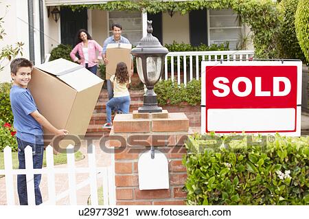 Stock Image - Family moving into new home. Fotosearch