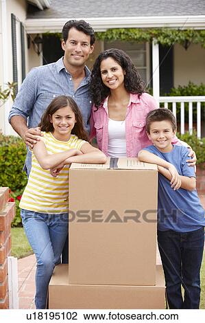 Stock Image - Family moving into new house. Fotosearch