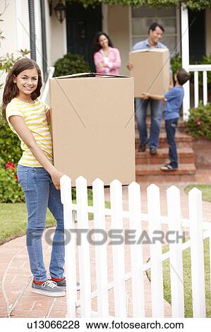 Stock Photo - Family moving into new house. Fotosearch