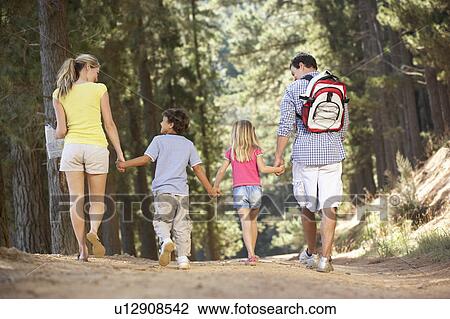 Stock Image - Family on country walk. Fotosearch