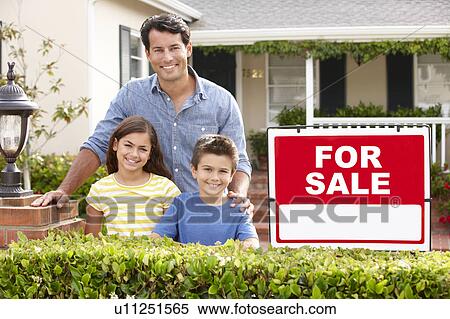 Stock Photography - Father and children outside home for sale. Fotosearch