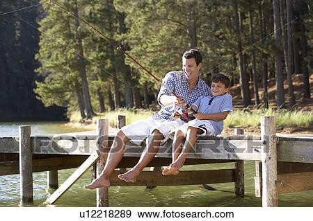 Father and son fishing together View Large Photo Image Stock Photo - Father and son fishing together. Fotosearch