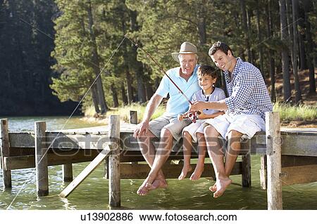 Stock Photograph - Father, son and grandson fishing together. Fotosearch