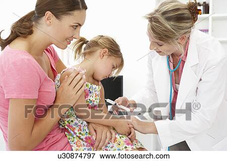 Stock Photo - Female doctor injecting child. Fotosearch