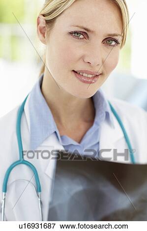 Stock Photo - Female doctor with x-ray. Fotosearch
