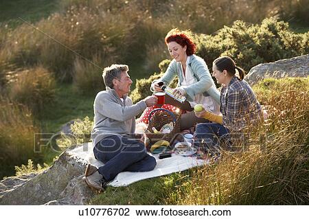 Friends on country picnic View Large Photo Image Stock Image - Friends on country picnic. Fotosearch