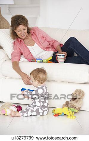 Grandmother with baby grandchild View Large Photo Image Stock Photo - Grandmother with baby grandchild. Fotosearch