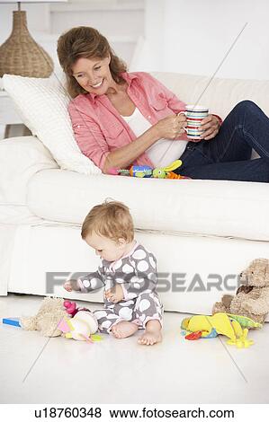 Grandmother with baby grandchild View Large Photo Image Stock Photo - Grandmother with baby grandchild. Fotosearch