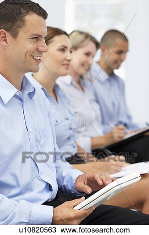 Group watching business presentation View Large Photo Image Stock Image - Group watching business presentation. Fotosearch