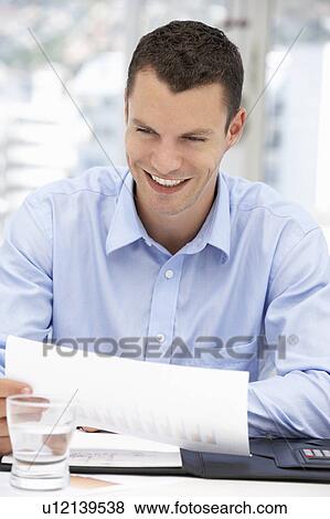 Stock Photo - Happy young businessman. Fotosearch