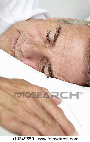Head and shoulders mid age man sleeping View Large Photo Image Stock Photo - Head and shoulders mid age man sleeping. Fotosearch