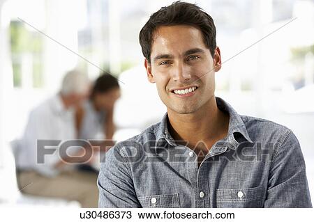Stock Image - Hispanic businessman in office. Fotosearch