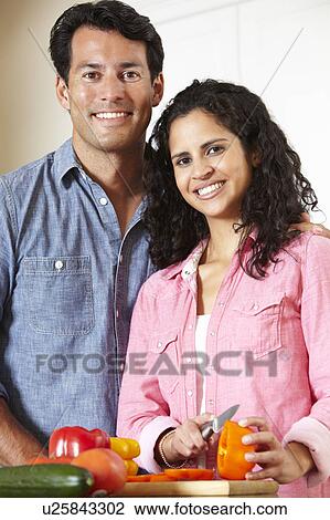 Hispanic couple cooking View Large Photo Image Stock Image - Hispanic couple cooking. Fotosearch