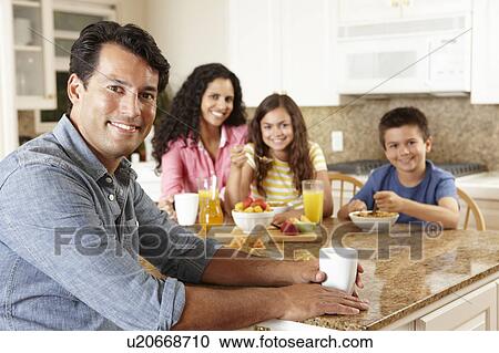 Hispanic family eating breakfast View Large Photo Image Stock Image - Hispanic family eating breakfast. Fotosearch