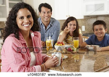 Hispanic family eating breakfast View Large Photo Image Stock Photo - Hispanic family eating breakfast. Fotosearch