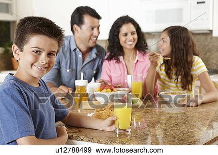 Hispanic family eating breakfast View Large Photo Image Stock Photo - Hispanic family eating breakfast. Fotosearch