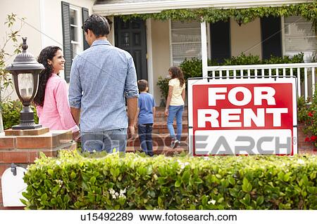 Hispanic family outside home for rent View Large Photo Image Stock Photo - Hispanic family outside home for rent. Fotosearch