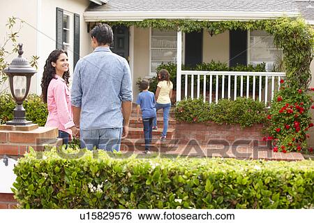 Hispanic family outside home for rent View Large Photo Image Stock Photograph - Hispanic family outside home for rent. Fotosearch