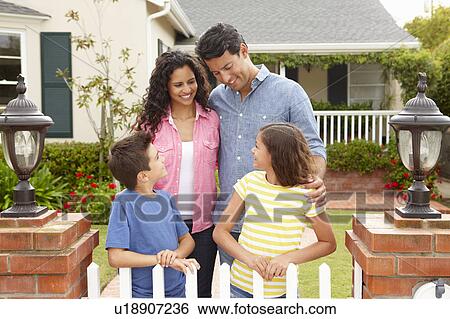 Hispanic family outside home View Large Photo Image Stock Photograph - Hispanic family outside home. Fotosearch