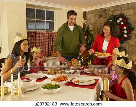 Hispanic family serving Christmas dinner View Large Photo Image Stock Image - Hispanic family serving Christmas dinner. Fotosearch