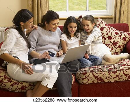 Hispanic family shopping online View Large Photo Image Stock Photo - Hispanic family shopping online. Fotosearch