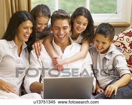 Stock Photography - Hispanic family shopping online. Fotosearch