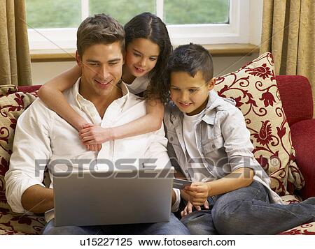 Hispanic father and children shopping online View Large Photo Image Stock Photography - Hispanic father and children shopping online. Fotosearch