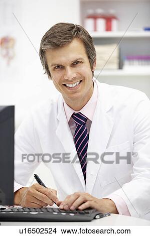 Picture - Hospital doctor at desk. Fotosearch