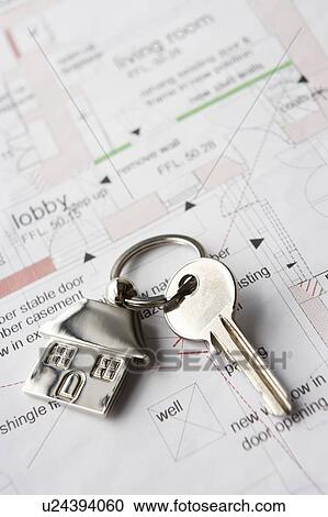 Stock Image - House key on ring. Fotosearch