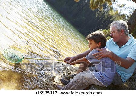 Man and boy fishing together View Large Photo Image Stock Photo - Man and boy fishing together. Fotosearch
